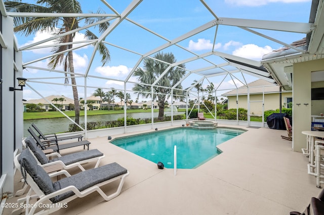 274 Clyde St, Melbourne Beach, FL 32951 - view of pool with a patio, a pool with connected hot tub, a water view, a lanai, and grilling area