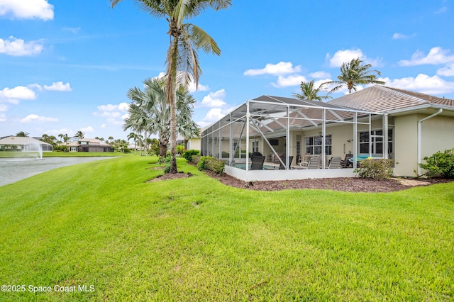 274 Clyde St, Melbourne Beach, FL 32951 - view of green lawn featuring a water view and a lanai