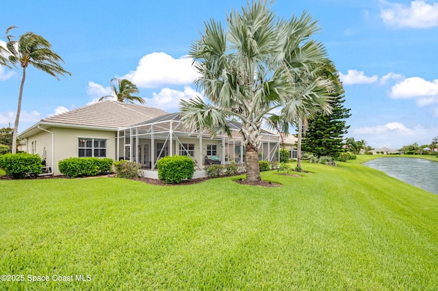 274 Clyde St, Melbourne Beach, FL 32951 - view of green lawn featuring a water view and a lanai