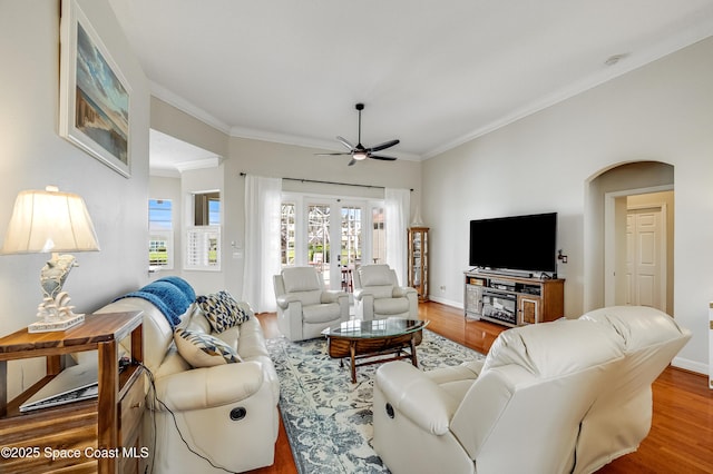 274 Clyde St, Melbourne Beach, FL 32951 - living area featuring ceiling fan, ornamental molding, wood finished floors, and baseboards