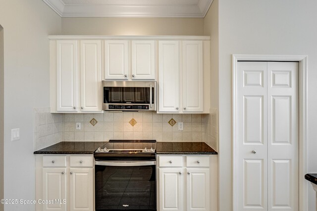 274 Clyde St, Melbourne Beach, FL 32951 - kitchen featuring appliances with stainless steel finishes, backsplash, dark stone counters, white cabinetry, and crown molding