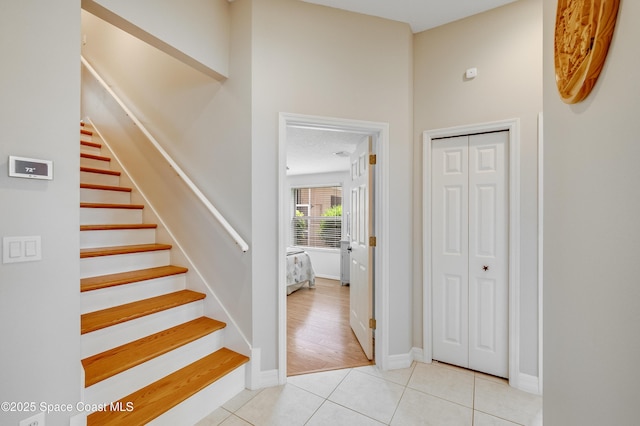 274 Clyde St, Melbourne Beach, FL 32951 - stairs featuring tile patterned floors and baseboards