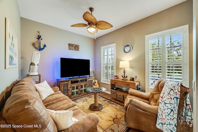 274 Clyde St, Melbourne Beach, FL 32951 - living room featuring a ceiling fan, wood finished floors, and baseboards