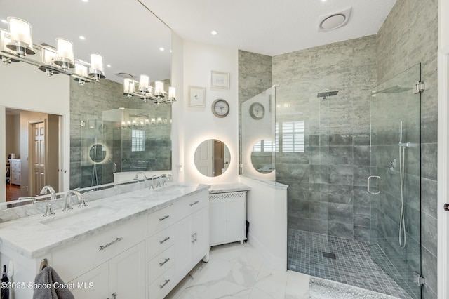 274 Clyde St, Melbourne Beach, FL 32951 - bathroom featuring a chandelier, double vanity, a stall shower, marble finish floors, and recessed lighting
