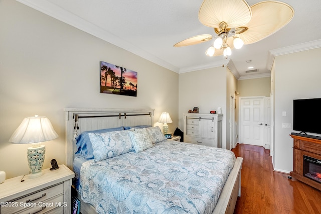 274 Clyde St, Melbourne Beach, FL 32951 - bedroom with wood finished floors, crown molding, a ceiling fan, recessed lighting, and baseboards