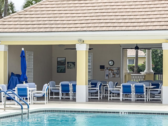 274 Clyde St, Melbourne Beach, FL 32951 - community pool featuring a ceiling fan and a patio