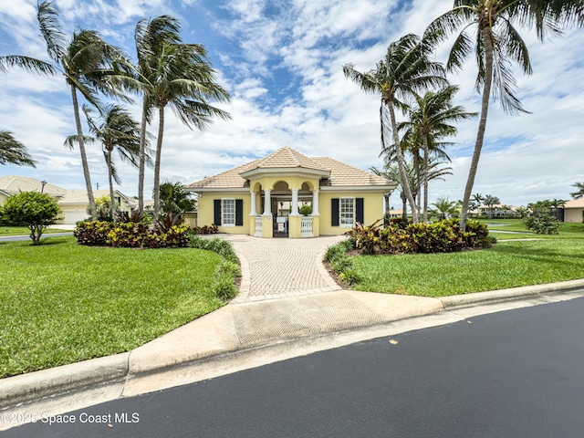 274 Clyde St, Melbourne Beach, FL 32951 - view of property with decorative driveway