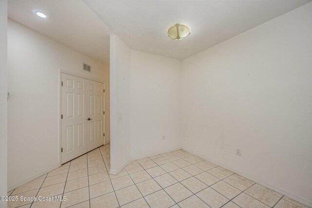 401 Trotter Ln Unit 103, Melbourne, FL 32940 - empty room with light tile patterned floors, recessed lighting, and baseboards