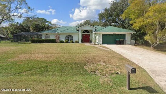 1066 Pennsylvania Ave NE, Palm Bay, FL 32907 - ranch-style home featuring a front yard, a garage, driveway, and metal roof
