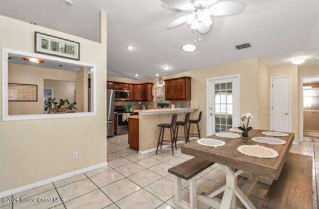 1066 Pennsylvania Ave NE, Palm Bay, FL 32907 - dining area featuring ceiling fan, light tile patterned floors, baseboards, and recessed lighting