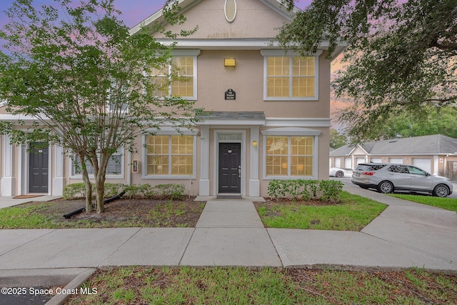 115 Turpial Way Unit 104, Melbourne, FL 32901 - view of front facade with stucco siding
