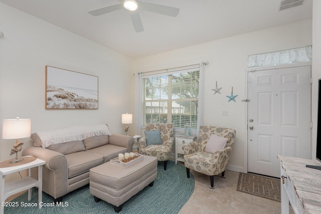 115 Turpial Way Unit 104, Melbourne, FL 32901 - living area with ceiling fan and light tile patterned floors