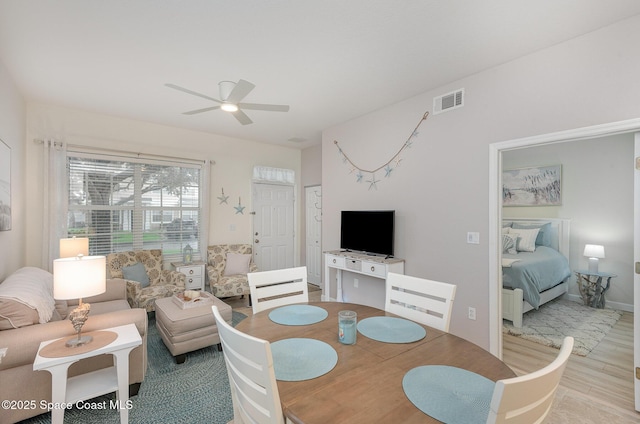 115 Turpial Way Unit 104, Melbourne, FL 32901 - dining area with a ceiling fan and wood finished floors