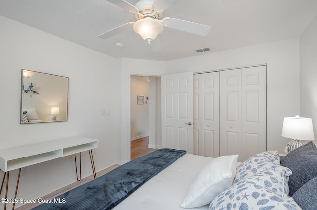 115 Turpial Way Unit 104, Melbourne, FL 32901 - bedroom with a closet, a ceiling fan, and baseboards