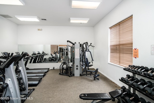 115 Turpial Way Unit 104, Melbourne, FL 32901 - exercise room featuring carpet floors