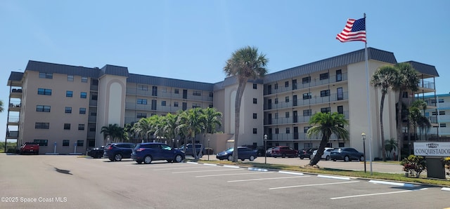 4100 Ocean Beach Blvd Unit 412, Cocoa Beach, FL 32931 - view of apartment building / complex with uncovered parking