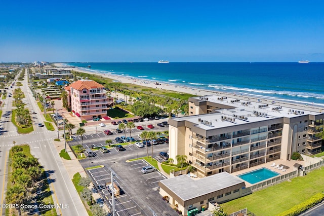 4100 Ocean Beach Blvd Unit 412, Cocoa Beach, FL 32931 - bird's eye view of waterfront with a beach and a pool