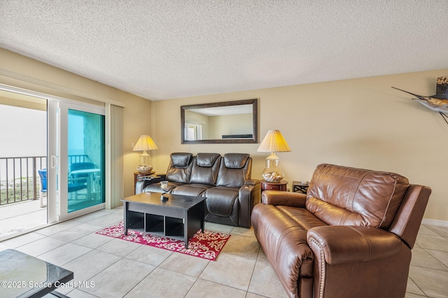 4100 Ocean Beach Blvd Unit 412, Cocoa Beach, FL 32931 - living area featuring a textured ceiling and light tile patterned floors