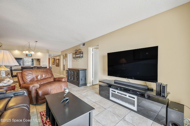 4100 Ocean Beach Blvd Unit 412, Cocoa Beach, FL 32931 - living room with a textured ceiling and light tile patterned flooring
