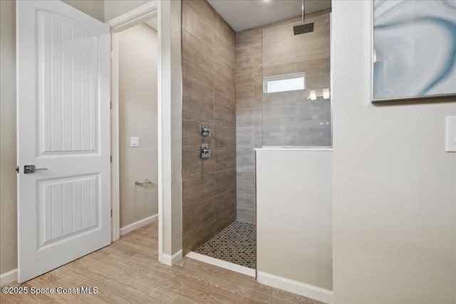 2377 Aquilos Ave SE Unit 46, Palm Bay, FL 32909 - full bath with walk in shower, wood finished floors, and baseboards