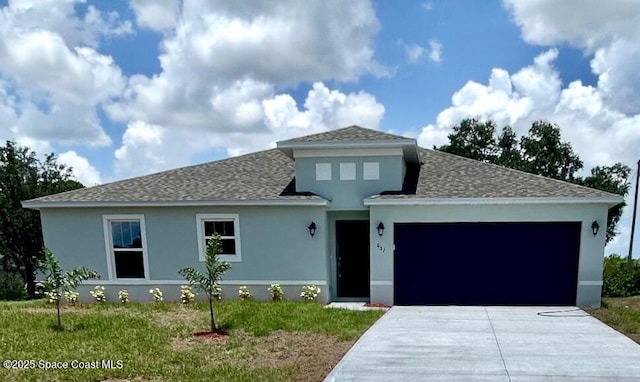 651 Merrimac St SE Unit 11, Palm Bay, FL 32909 - view of front of home featuring an attached garage, driveway, a shingled roof, and stucco siding