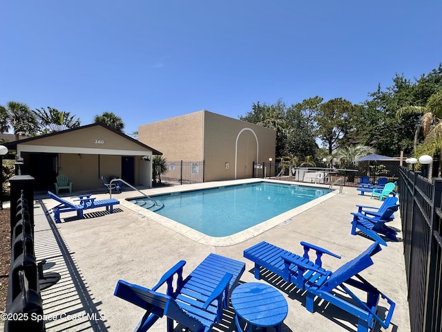 225 Spring Dr Unit 3, Merritt Island, FL 32953 - community pool featuring a patio area