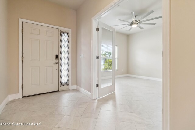 2262 Lune Ct, West Melbourne, FL 32904 - foyer featuring a ceiling fan and baseboards