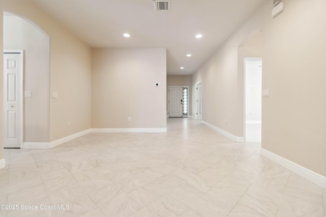 2262 Lune Ct, West Melbourne, FL 32904 - spare room with recessed lighting, arched walkways, baseboards, and light marble finish floors