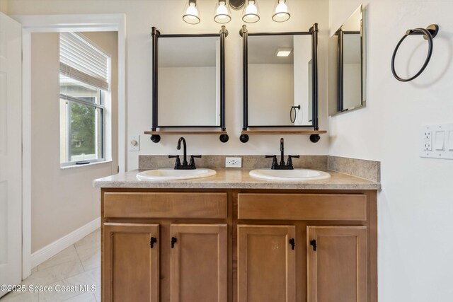 2262 Lune Ct, West Melbourne, FL 32904 - full bathroom featuring double vanity, baseboards, and marble look tile flooring