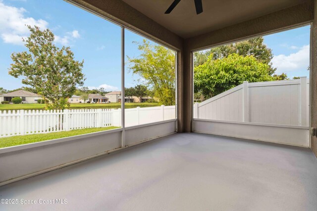 2262 Lune Ct, West Melbourne, FL 32904 - unfurnished sunroom with ceiling fan, a water view, and a residential view