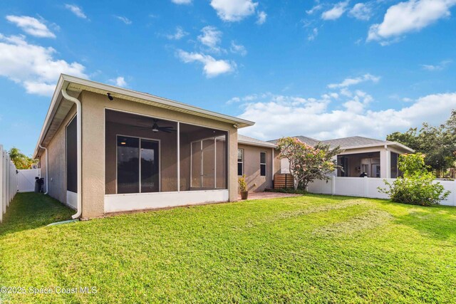2262 Lune Ct, West Melbourne, FL 32904 - rear view of house with a sunroom, stucco siding, and ceiling fan