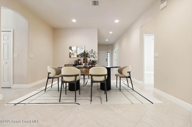 2262 Lune Ct, West Melbourne, FL 32904 - dining space with recessed lighting, arched walkways, and baseboards