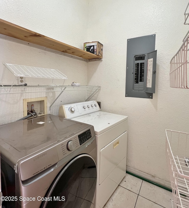 4155 Devoe Ave, Cocoa, FL 32927 - washroom with electric panel, independent washer and dryer, and light tile patterned floors