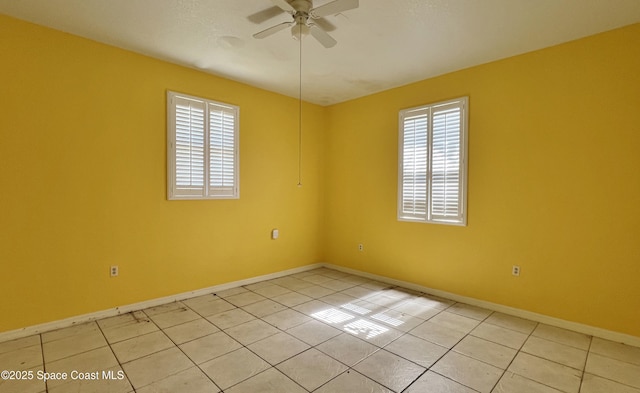 4155 Devoe Ave, Cocoa, FL 32927 - spare room featuring plenty of natural light, ceiling fan, baseboards, and light tile patterned floors