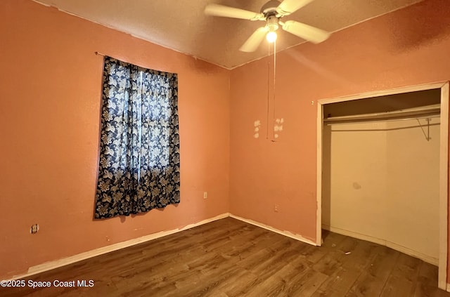 4155 Devoe Ave, Cocoa, FL 32927 - unfurnished bedroom with wood finished floors, a closet, and a ceiling fan