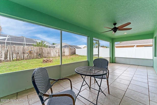 3817 Sunbeam Ct, Merritt Island, FL 32953 - sunroom with a fire pit and ceiling fan