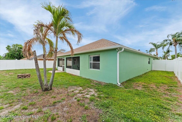 3817 Sunbeam Ct, Merritt Island, FL 32953 - rear view of property with stucco siding, a sunroom, and a shingled roof