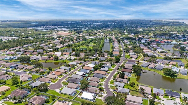 3817 Sunbeam Ct, Merritt Island, FL 32953 - aerial view of property and surrounding area with a large body of water and nearby suburban area