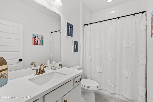 2376 Kamin Dr, Melbourne, FL 32940 - bathroom featuring vanity, toilet, a shower with shower curtain, and recessed lighting