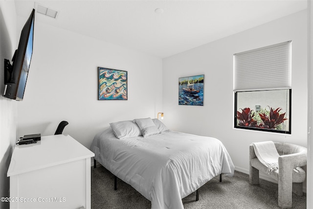 2376 Kamin Dr, Melbourne, FL 32940 - carpeted bedroom featuring baseboards