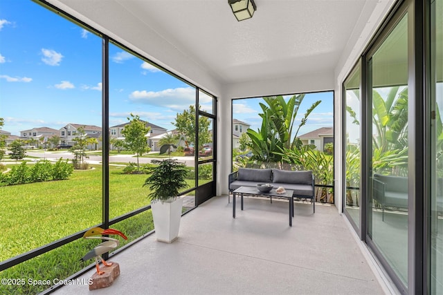 2376 Kamin Dr, Melbourne, FL 32940 - sunroom featuring a residential view, speckled floor, and a textured ceiling