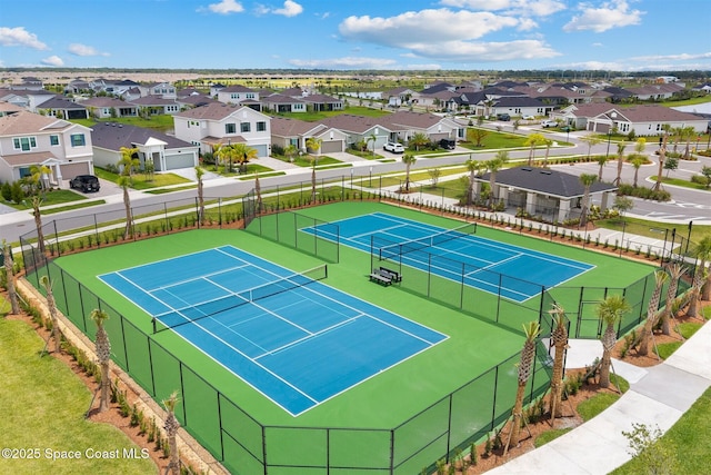 2376 Kamin Dr, Melbourne, FL 32940 - view of tennis court featuring a residential view