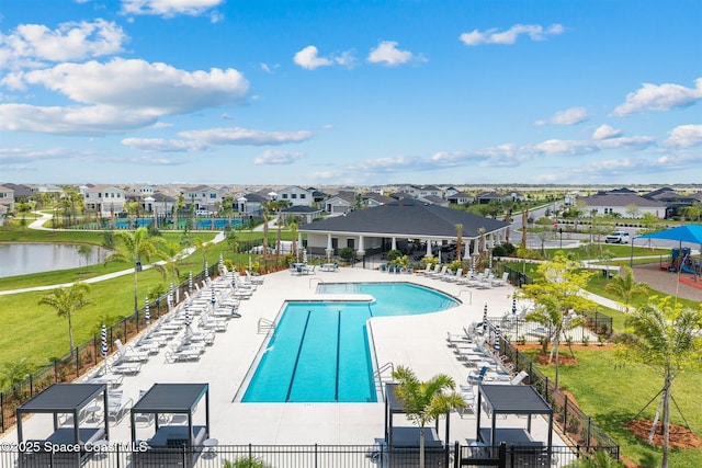 2376 Kamin Dr, Melbourne, FL 32940 - community pool featuring a patio, a residential view, and a water view