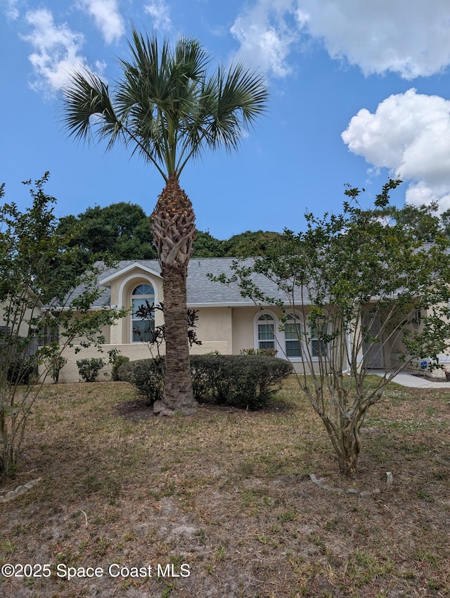 862 Aachen Ave NW, Palm Bay, FL 32907 - view of front of house with stucco siding