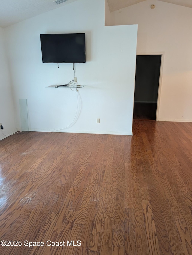 862 Aachen Ave NW, Palm Bay, FL 32907 - empty room featuring wood finished floors and lofted ceiling