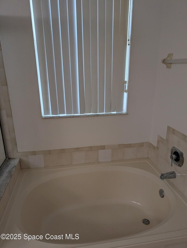 862 Aachen Ave NW, Palm Bay, FL 32907 - bathroom with a garden tub