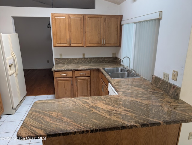 862 Aachen Ave NW, Palm Bay, FL 32907 - kitchen with white appliances, a sink, a peninsula, light tile patterned floors, and dark countertops