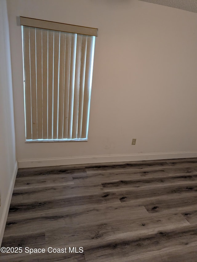 862 Aachen Ave NW, Palm Bay, FL 32907 - unfurnished room with dark wood-type flooring and baseboards