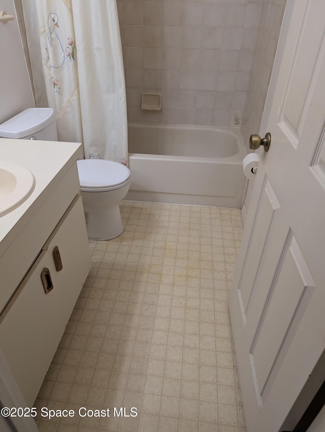 862 Aachen Ave NW, Palm Bay, FL 32907 - full bathroom with toilet, vanity, shower / bath combo with shower curtain, and tile patterned floors