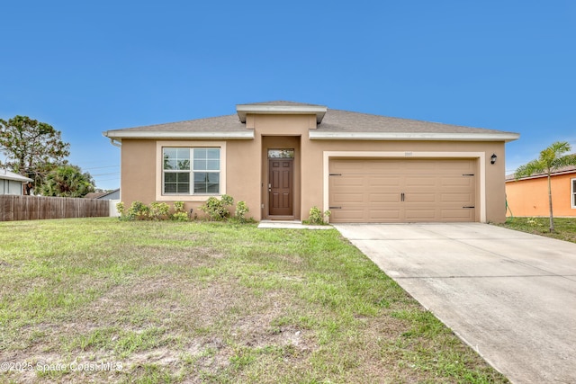 1005 Slocum St NW, Palm Bay, FL 32907 - view of front of home with stucco siding, a garage, and driveway